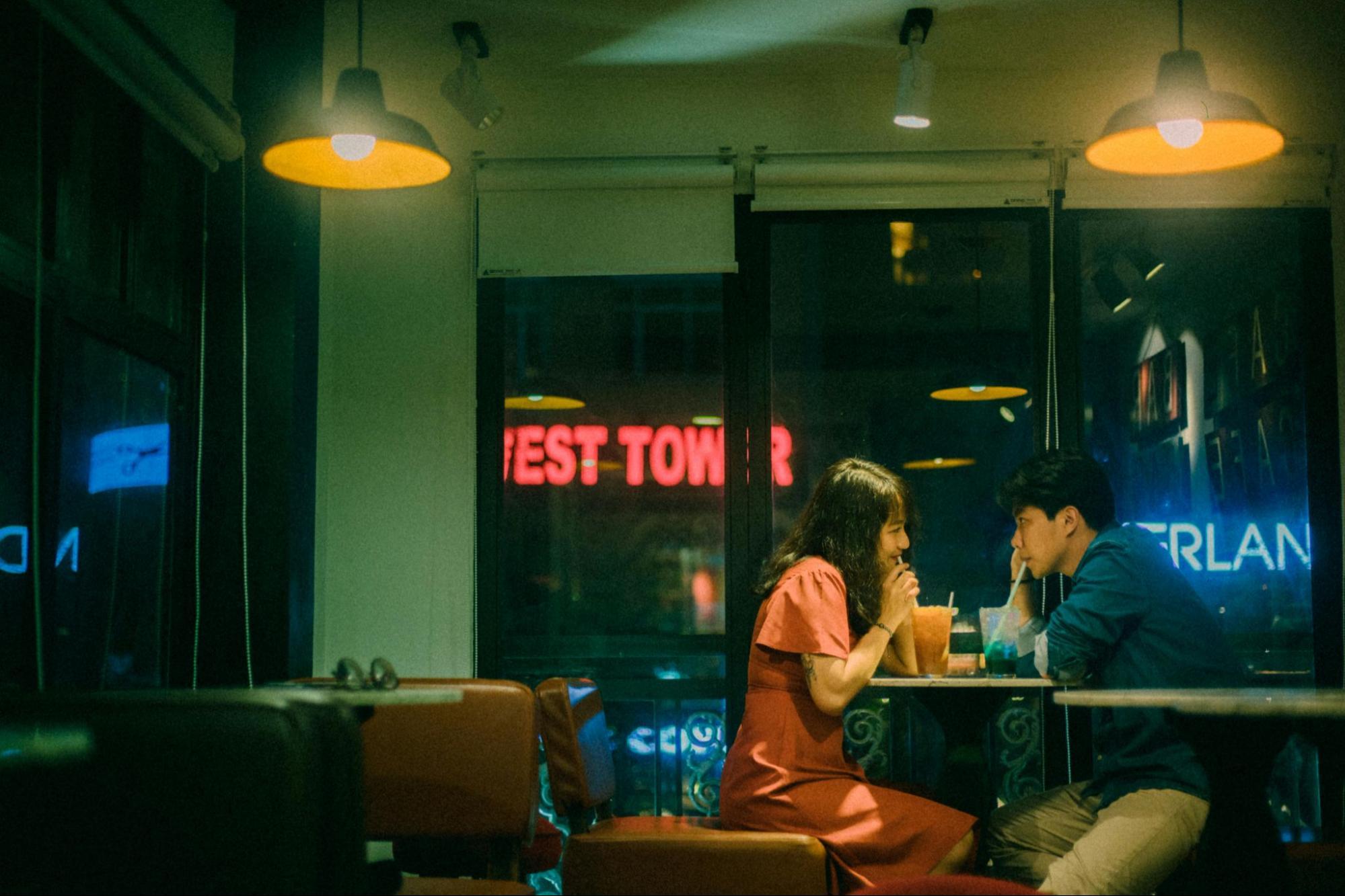 couple sitting in a cafe enjoying a coffee date